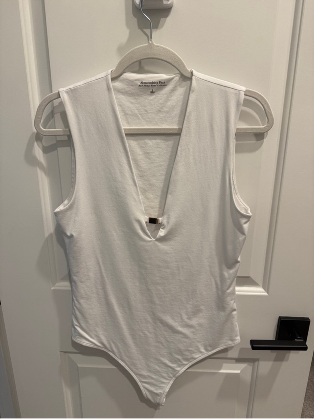 Abercrombie & Fitch White Sleeveless V‑Neck Bodysuit with Accent